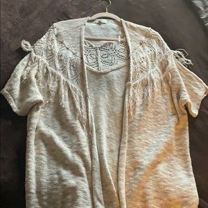 Cream colored cardigan.